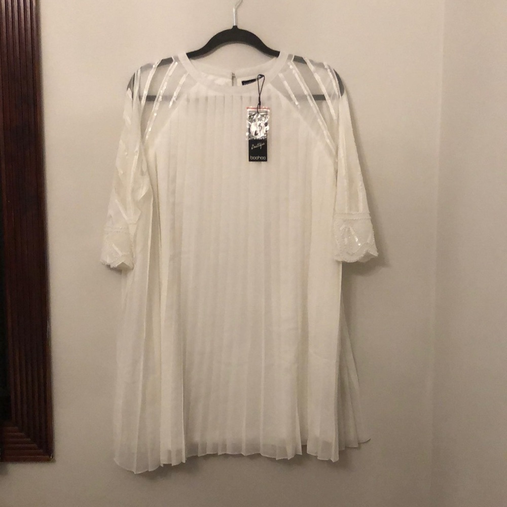 White frilled dress with sequence on the side